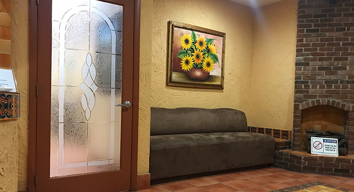 dental clinic waiting area with a comfortable couch